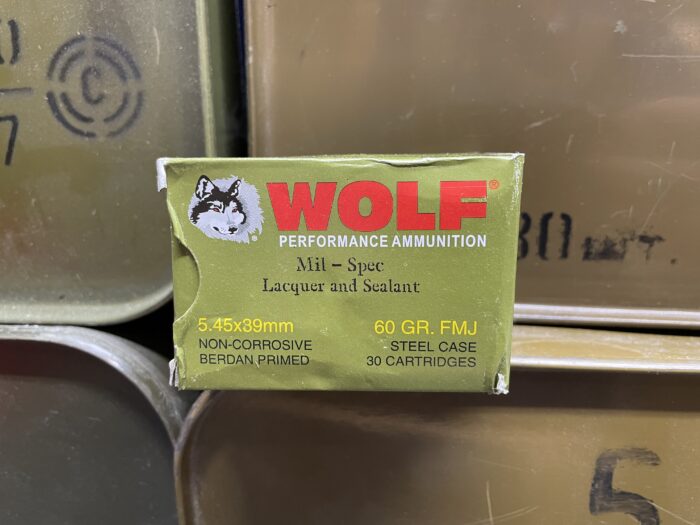 A box of wolf lacquered and sealed 5.45x39mm ammo. 30 rounds per box.